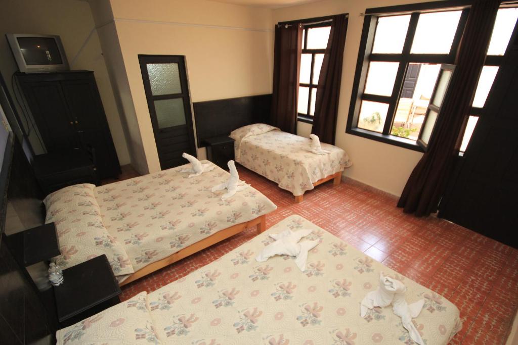 Postel nebo postele na pokoji v ubytování Hotel San Martin