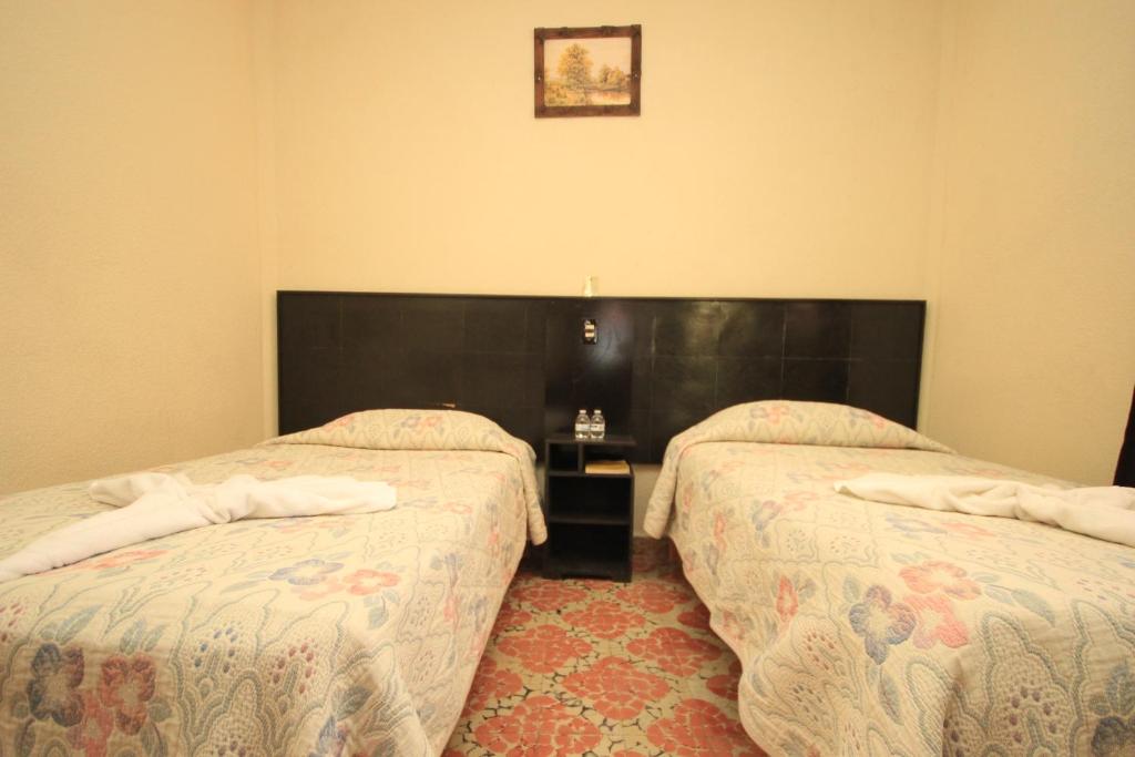 Postel nebo postele na pokoji v ubytování Hotel San Martin