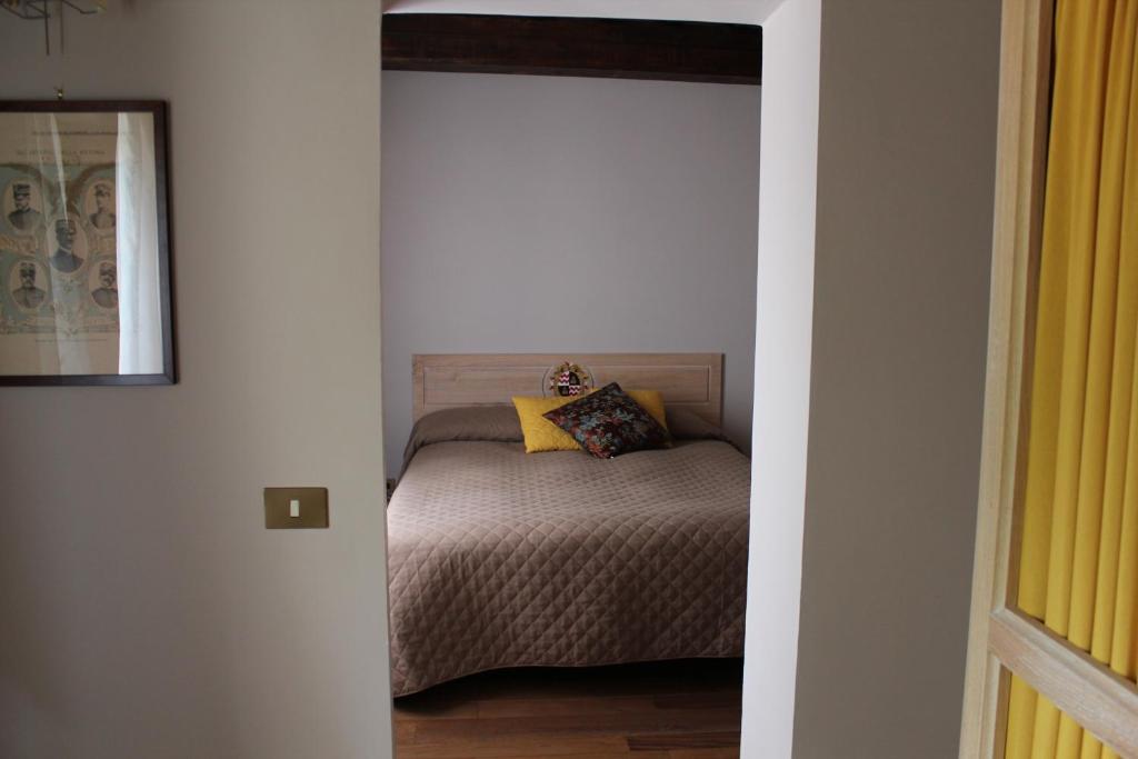 Łóżko lub łóżka w pokoju w obiekcie Dimora di Collio