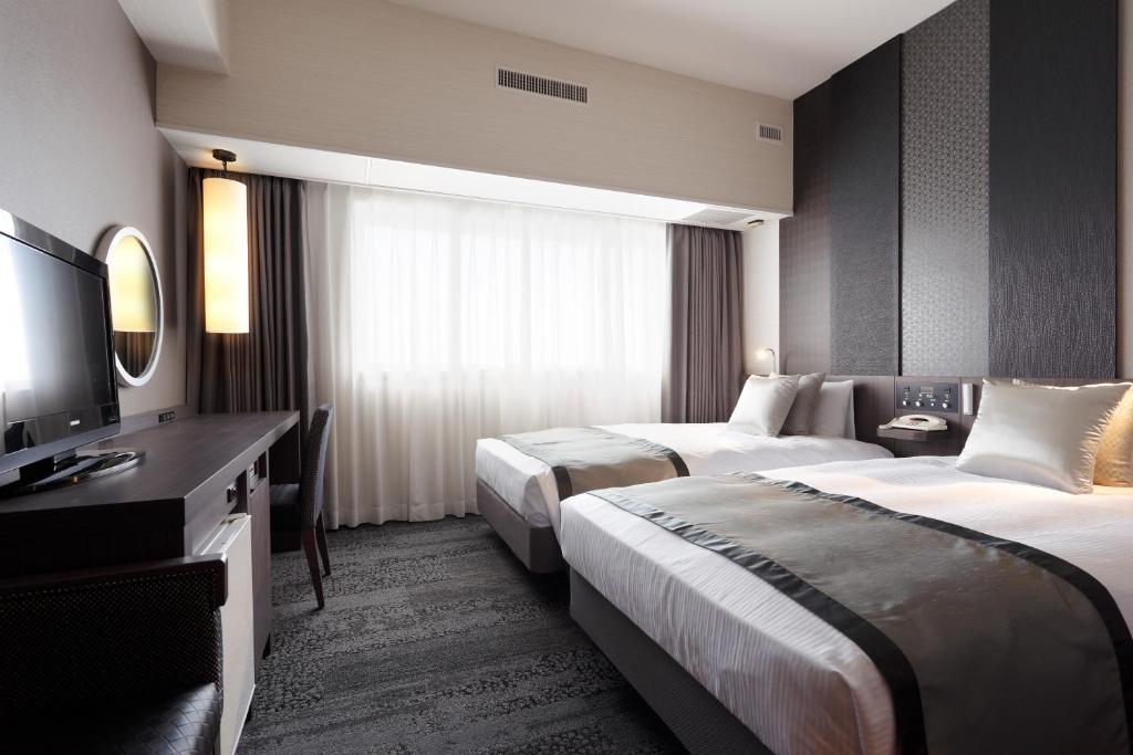 Postel nebo postele na pokoji v ubytování Art Hotel Narita
