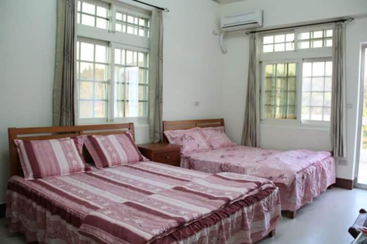 Postel nebo postele na pokoji v ubytování Xiang Pin Yuan Homestay