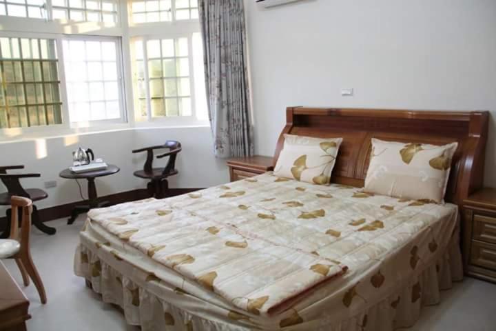 Postel nebo postele na pokoji v ubytování Xiang Pin Yuan Homestay