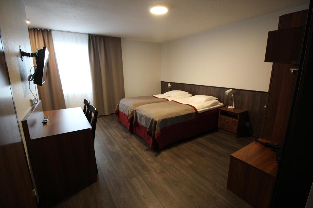 Postel nebo postele na pokoji v ubytování Motel SEO Muonio