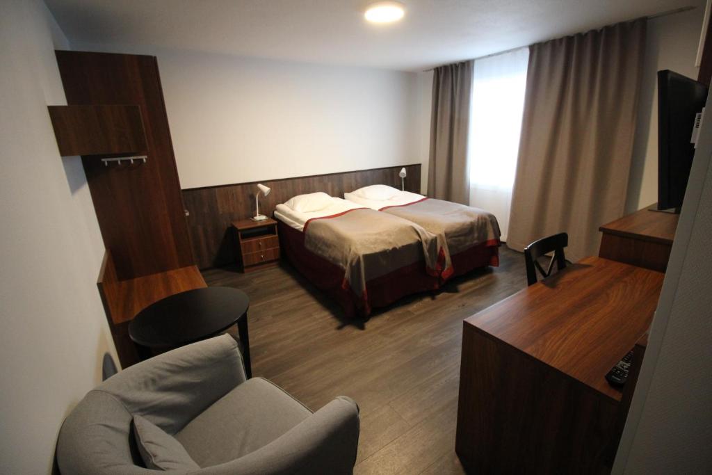 Postel nebo postele na pokoji v ubytování Motel SEO Muonio