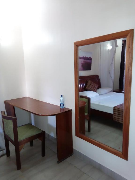 Postel nebo postele na pokoji v ubytování Lambada Holiday Resort Mombasa