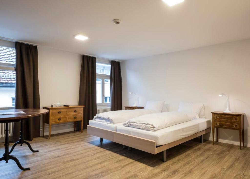 Postel nebo postele na pokoji v ubytování Hotel Vadian Garni