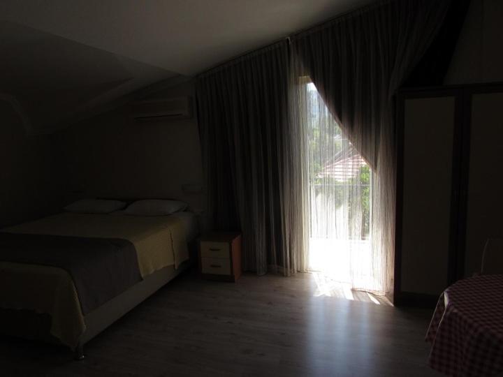 Postel nebo postele na pokoji v ubytování Dogan Apart Hotel