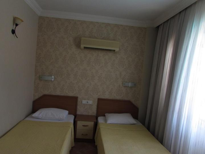 Postel nebo postele na pokoji v ubytování Dogan Apart Hotel