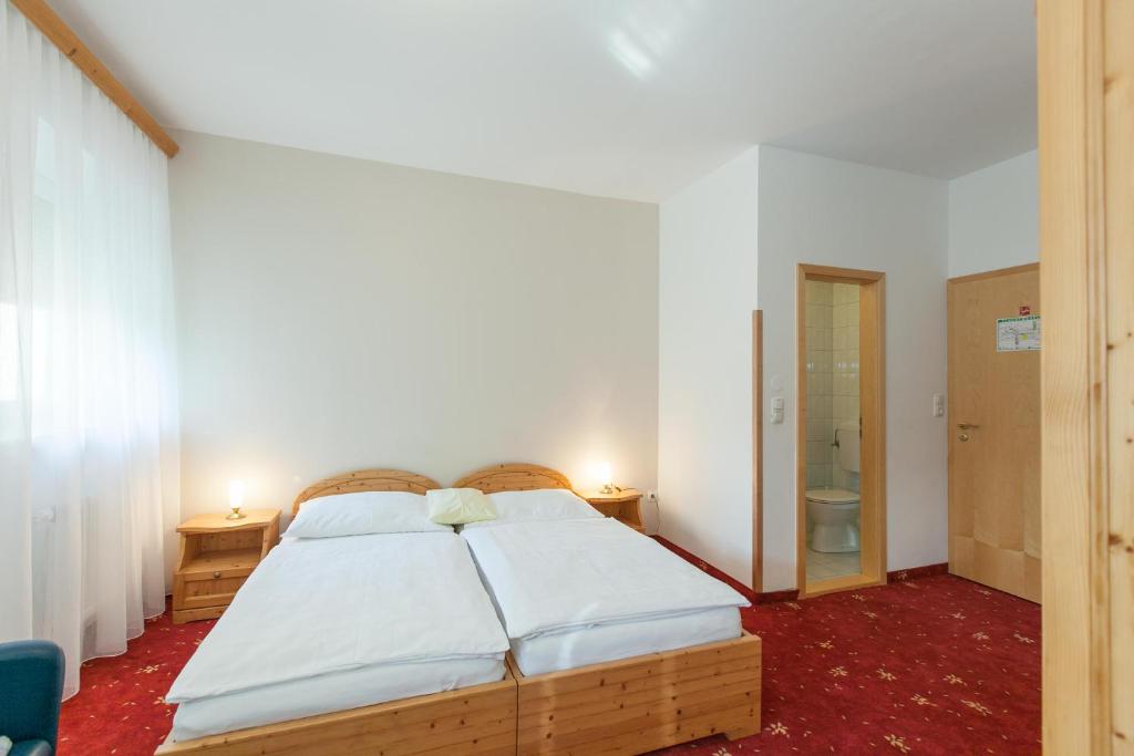 Postel nebo postele na pokoji v ubytování Hotel Vösenhuber