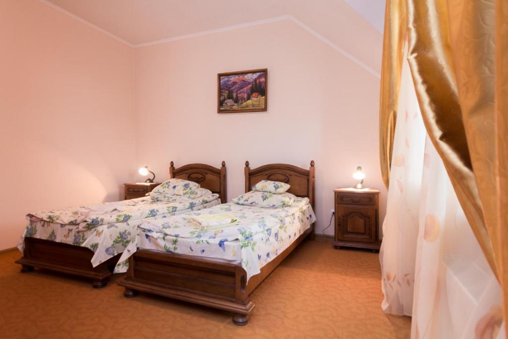 Postel nebo postele na pokoji v ubytování Gortenziya