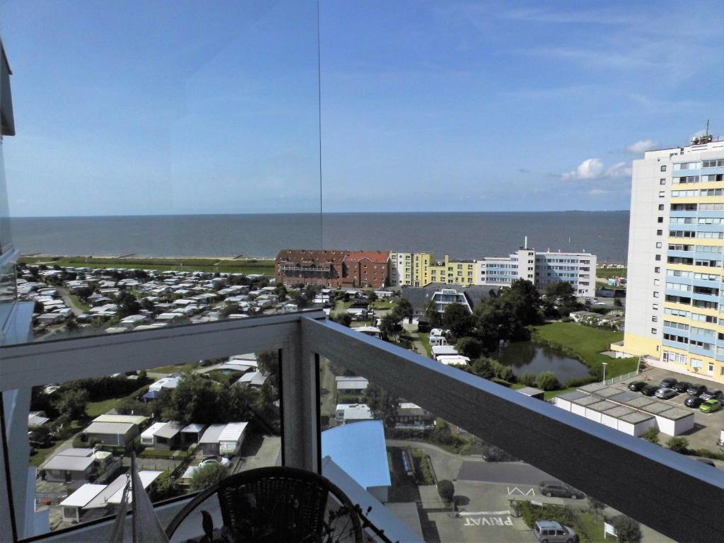 a view of the ocean from the balcony of a condo at Frische Brise Sahlenburg in Cuxhaven