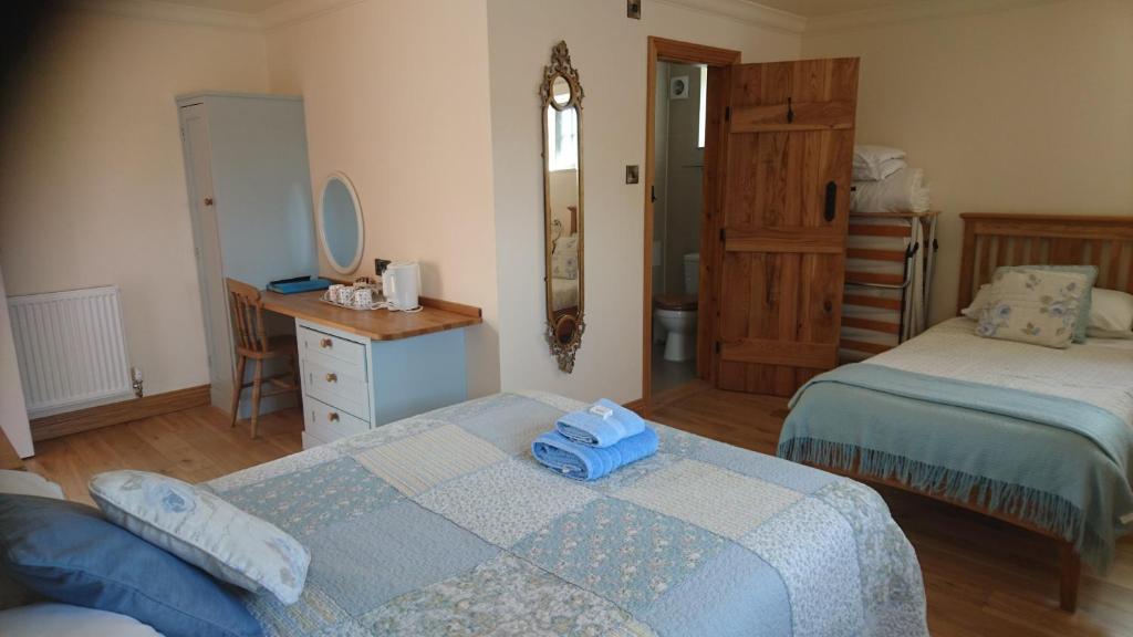Postel nebo postele na pokoji v ubytování Church Farm Accommodation