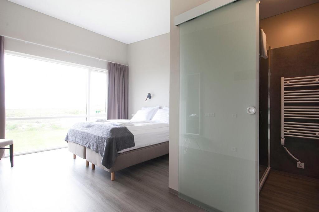 Voodi või voodid majutusasutuse Arnarstapi Hotel toas