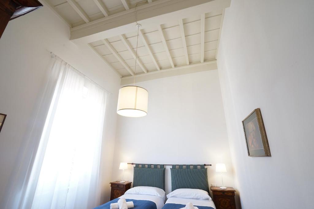 A bed or beds in a room at Soderini Palace
