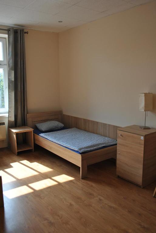 Postel nebo postele na pokoji v ubytování Hostel Katowice Centrum