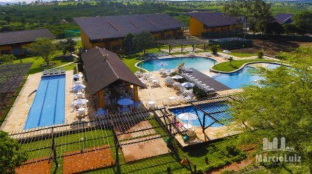 an aerial view of a house with two swimming pools at Winterville Flats Gravatá in Gravatá