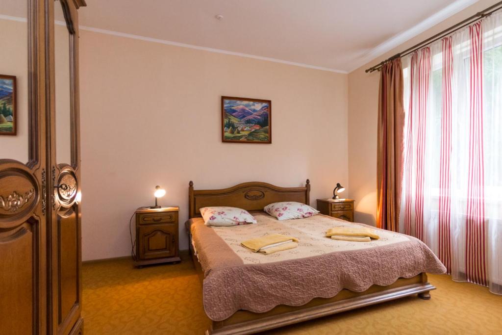 Postel nebo postele na pokoji v ubytování Gortenziya