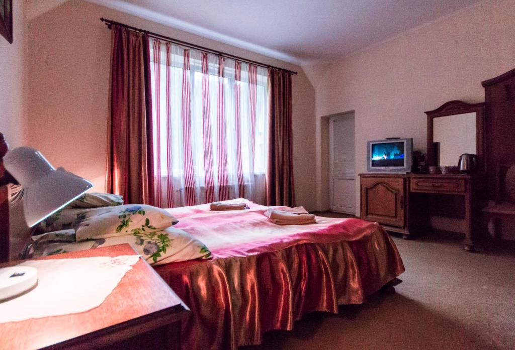 Postel nebo postele na pokoji v ubytování Gortenziya