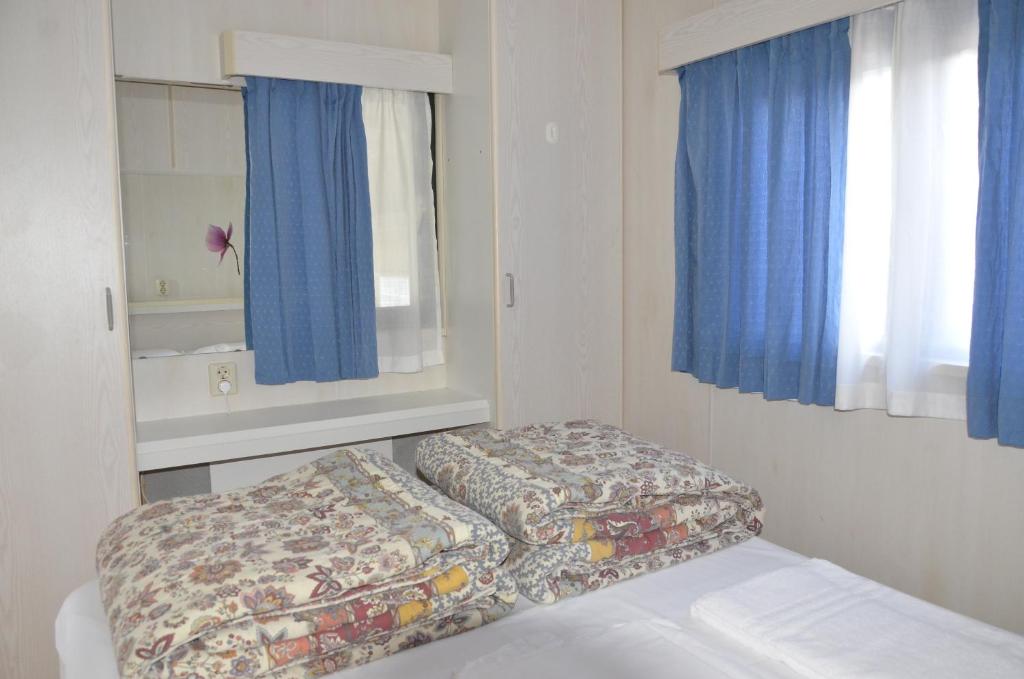 Letto o letti in una camera di Camping Adamello