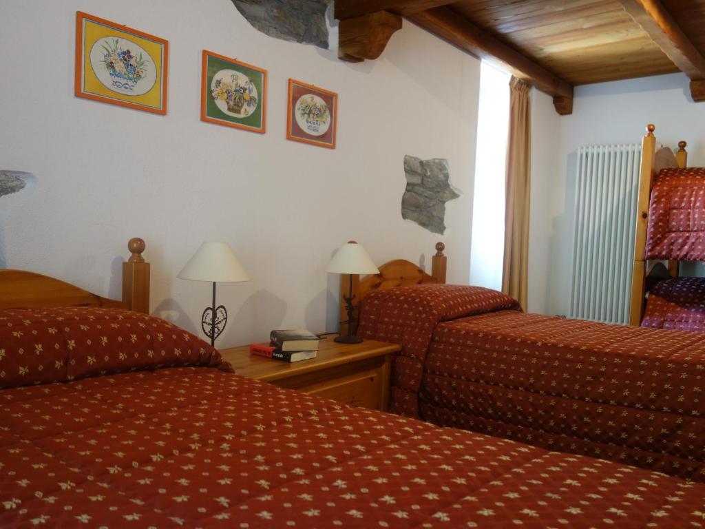Postel nebo postele na pokoji v ubytování Auberge Lou Créton di Lui Hostel