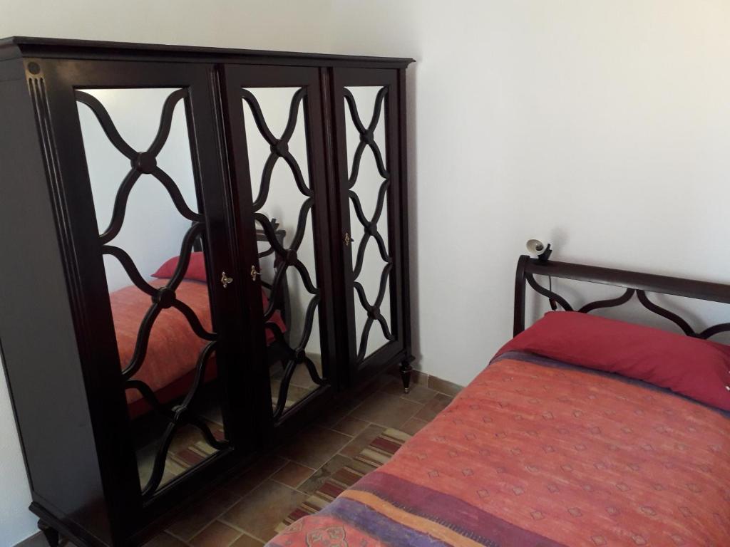 A bed or beds in a room at Antica Casa in Pietra