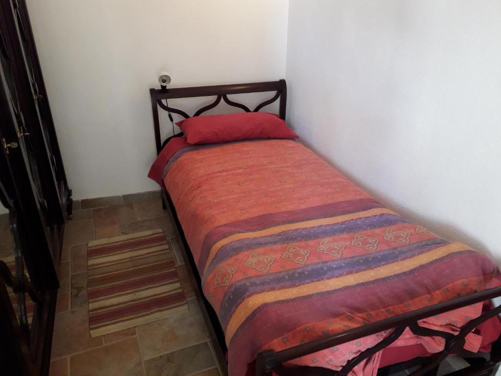 Кровать или кровати в номере Antica Casa in Pietra