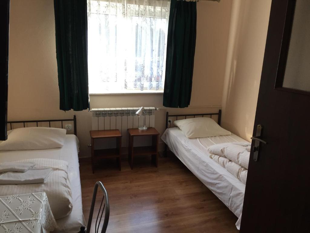 Łóżko lub łóżka w pokoju w obiekcie Motel u Olka Boczów