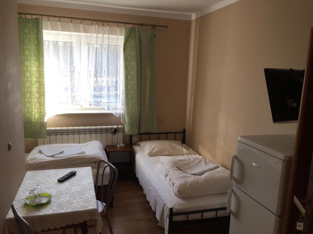 Łóżko lub łóżka w pokoju w obiekcie Motel u Olka Boczów