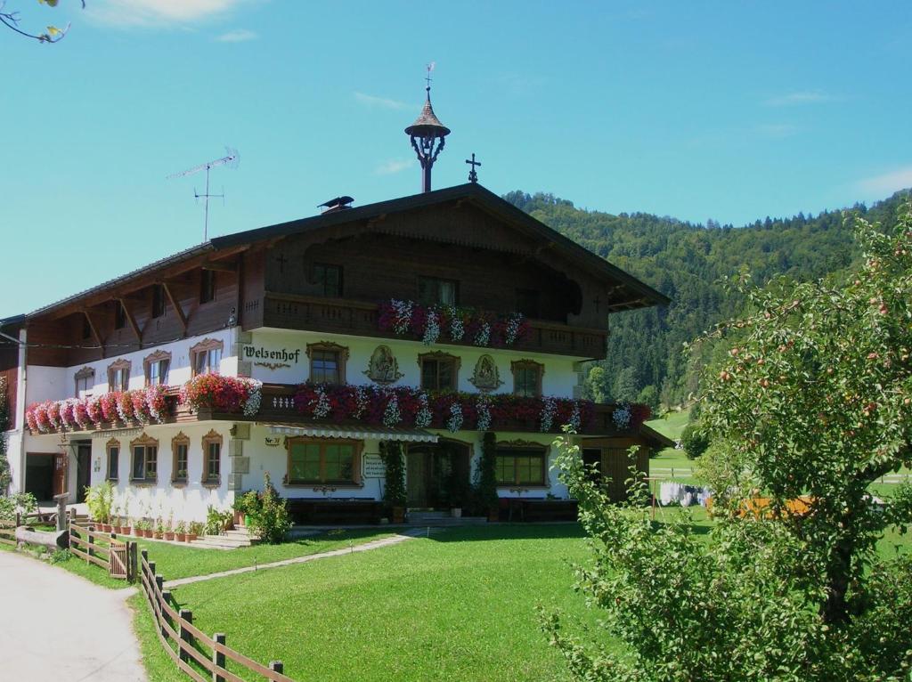 a large building with flowers on the roof at Welzenhof in Walchsee