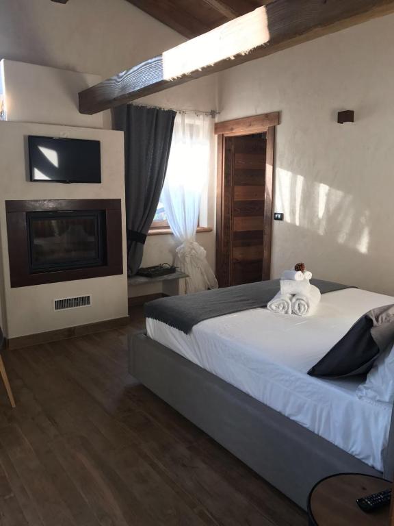 Postel nebo postele na pokoji v ubytování B&B Lo Matsòn