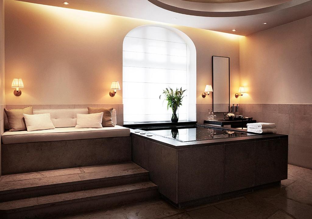 a bedroom with a large bed with a window at Grand Hôtel Stockholm in Stockholm