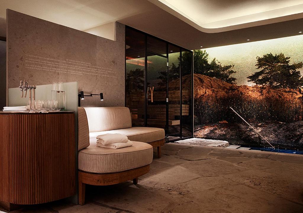 a room with a chair and a glass shower at Grand Hôtel Stockholm in Stockholm