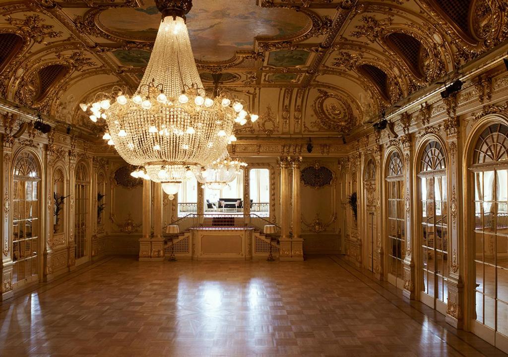 a large room with a chandelier in a building at Grand Hôtel Stockholm in Stockholm