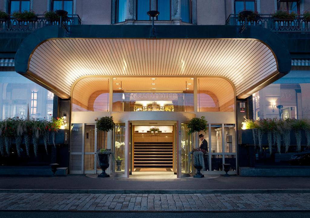 a lobby of a building with a person walking into it at Grand Hôtel Stockholm in Stockholm