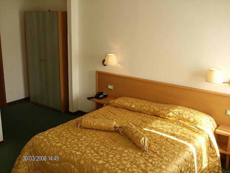 Postel nebo postele na pokoji v ubytování Hotel Etruria