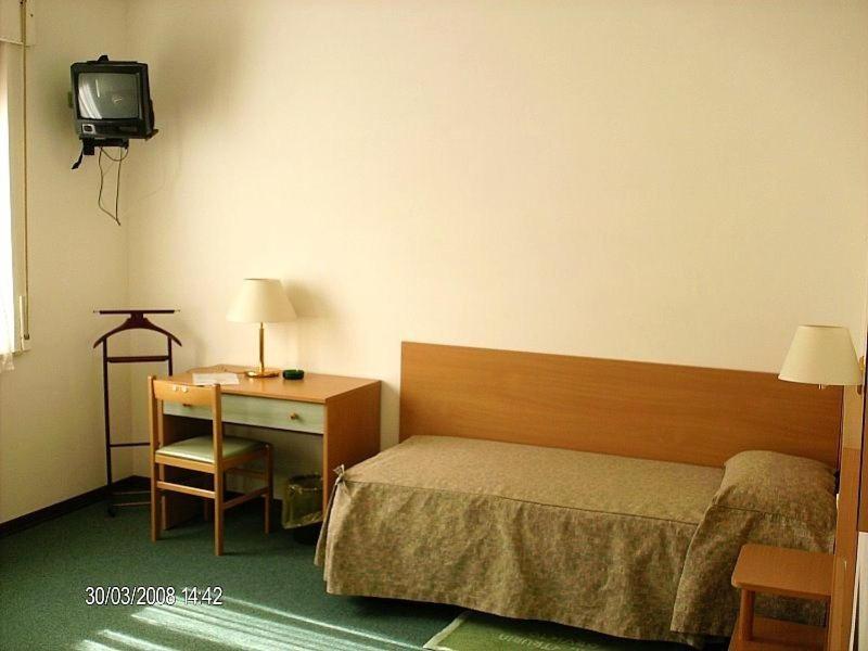 Postel nebo postele na pokoji v ubytování Hotel Etruria