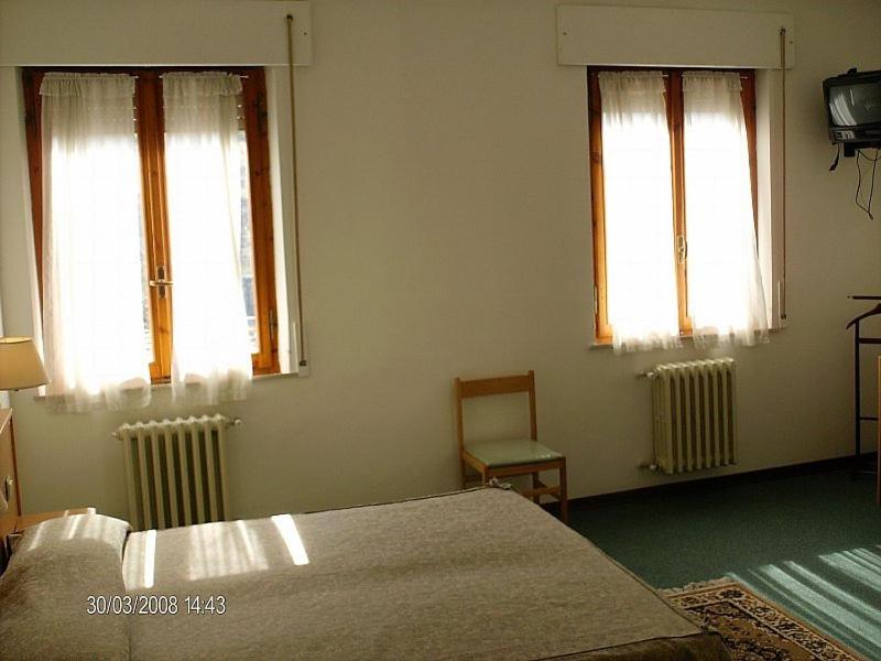 Postel nebo postele na pokoji v ubytování Hotel Etruria