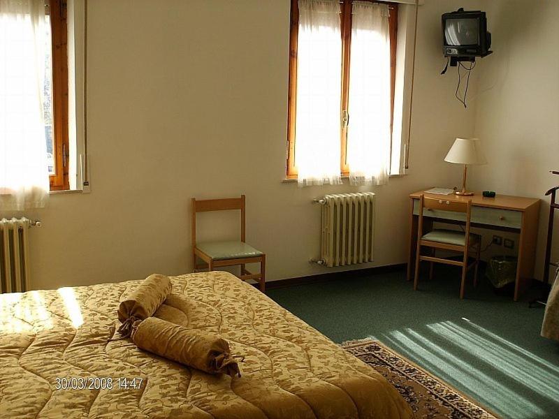 Postel nebo postele na pokoji v ubytování Hotel Etruria