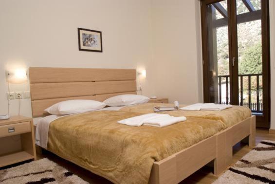 Postel nebo postele na pokoji v ubytování Samaria Village