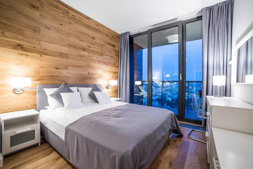 Säng eller sängar i ett rum på NordicHaven Apartments