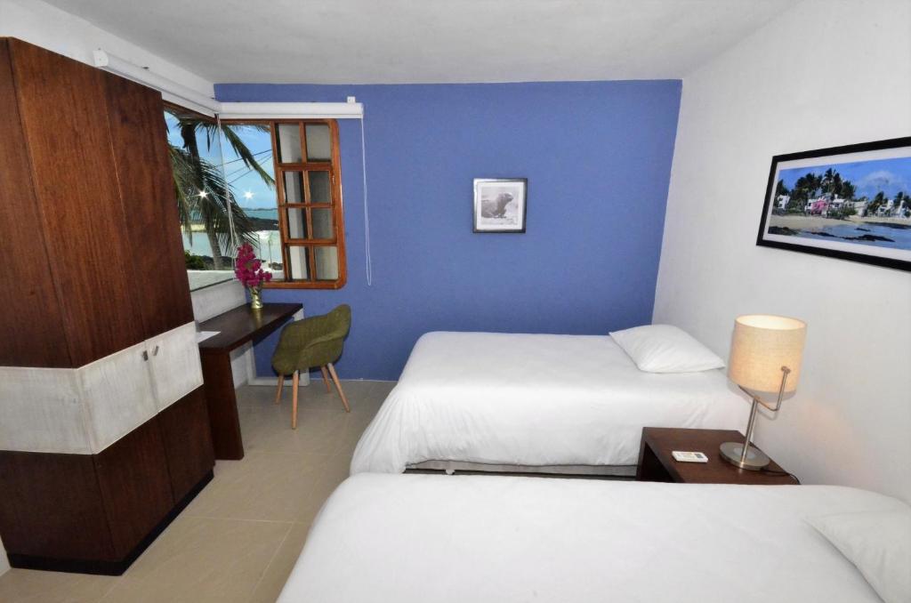 Postel nebo postele na pokoji v ubytování Casita de la Playa