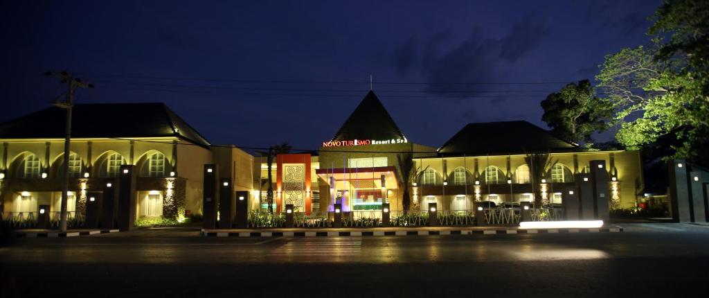 a large building with lights on it at night at Novo Turismo Resort & Spa in Dili