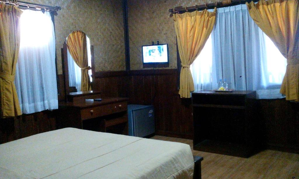 Postel nebo postele na pokoji v ubytování Bali Diva Hotel Kuta