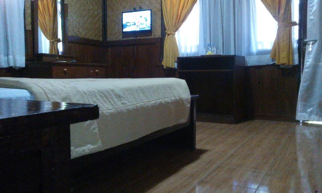 Postel nebo postele na pokoji v ubytování Bali Diva Hotel Kuta