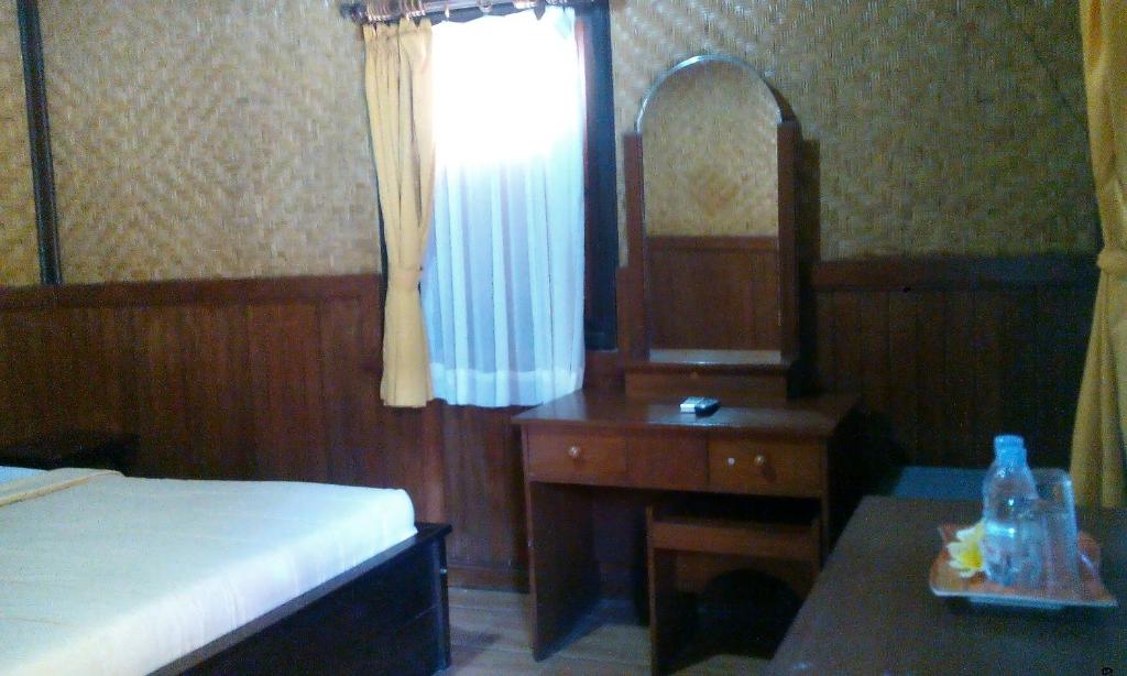 Postel nebo postele na pokoji v ubytování Bali Diva Hotel Kuta