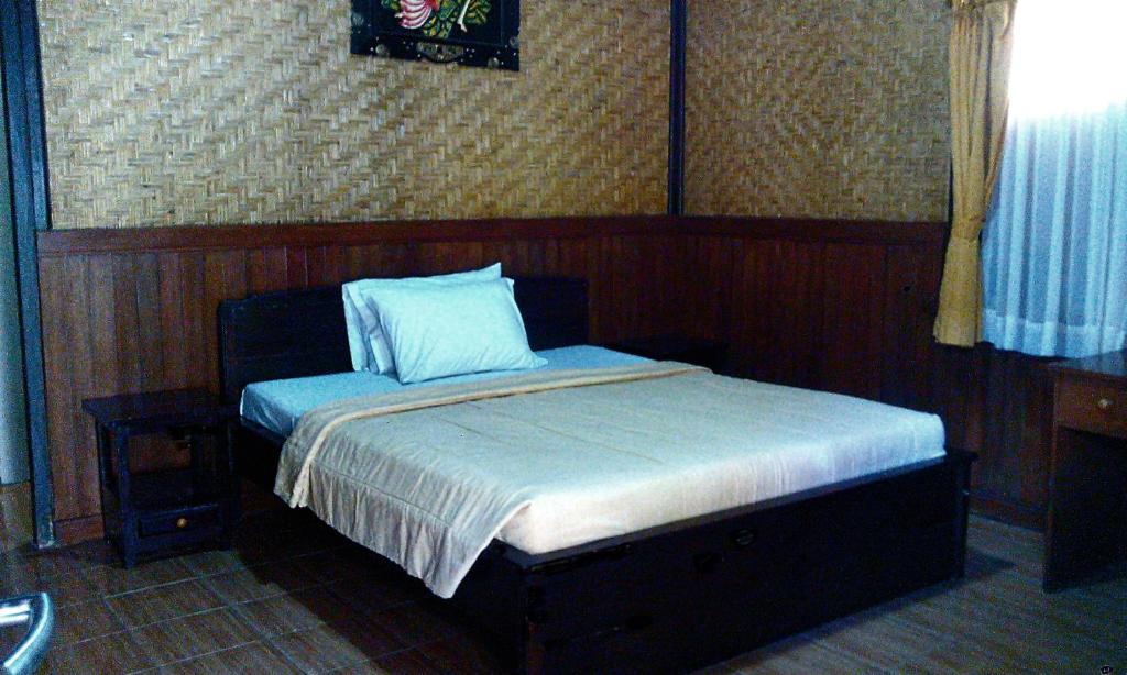 Postel nebo postele na pokoji v ubytování Bali Diva Hotel Kuta