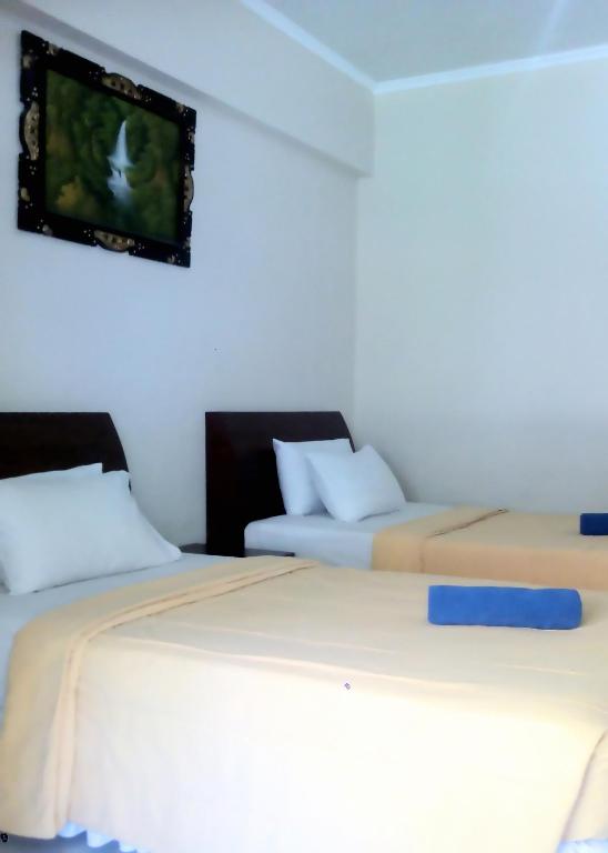 Postel nebo postele na pokoji v ubytování Bali Diva Hotel Kuta