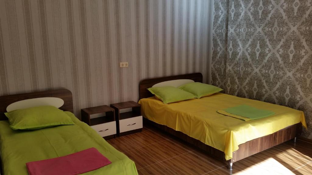 Postel nebo postele na pokoji v ubytování Hotel Kvariati Nugo