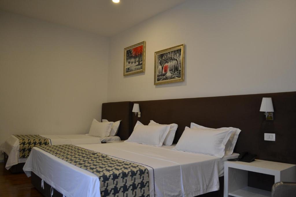Postel nebo postele na pokoji v ubytování Havana Hotel