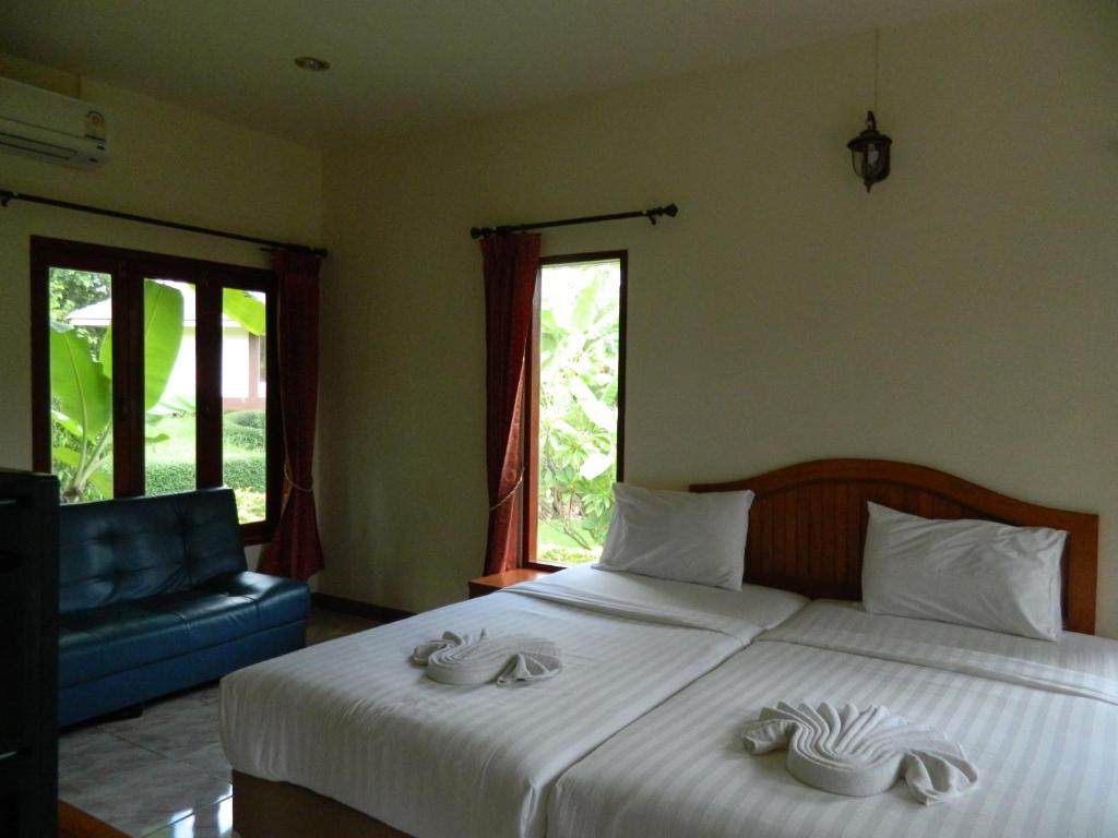 Postel nebo postele na pokoji v ubytování Pai Iyara Resort